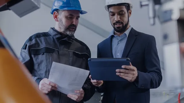 Employees of a company reviewing production costs.