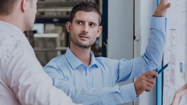 Executives designing the production plan for their company.