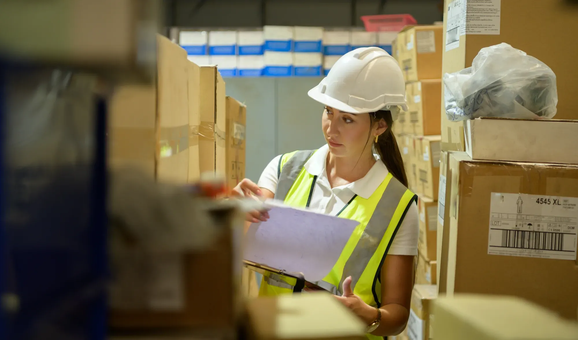 Warehouse operator checking SKUs in the catalogue.